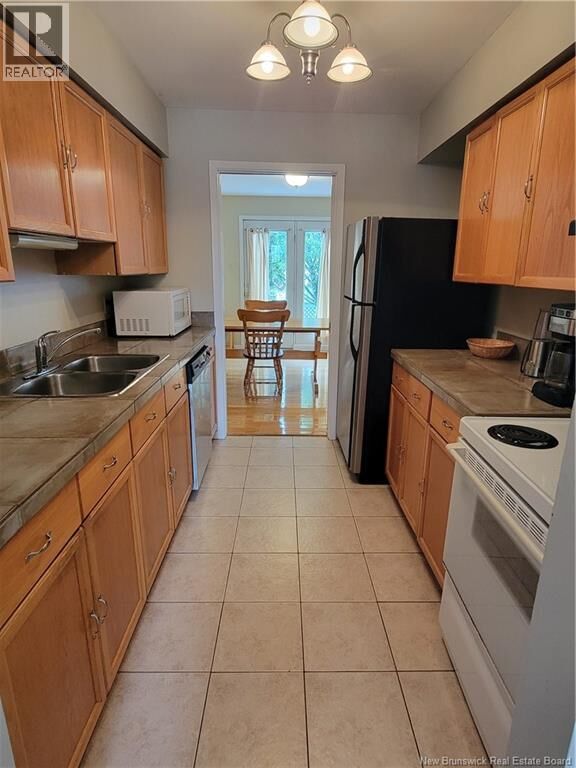 Property Photo:  59 Brentwood Crescent  NB E2K 4S1 