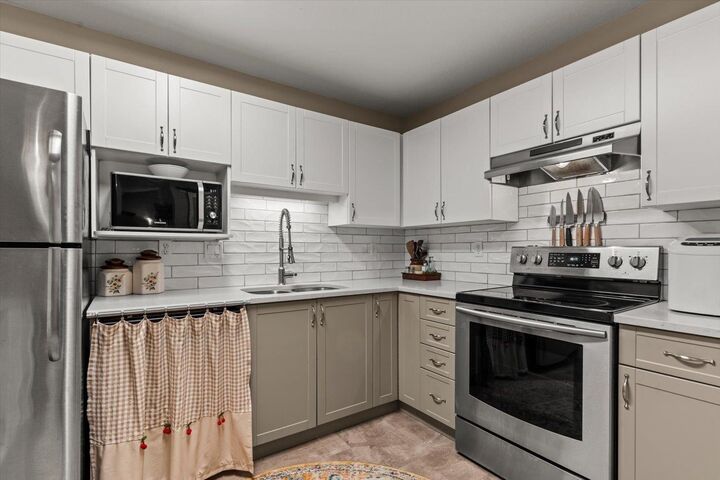 Property Photo: 20200 54A Avenue 209 BC V3A 3W7