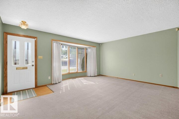 Property Photo:  13008 135 Street NW  AB T5L 1Y5 
