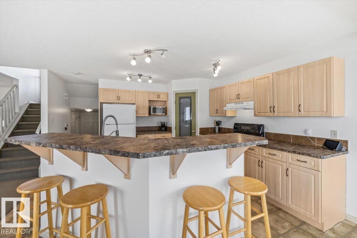 Property Photo:  8509 7 Avenue SW  AB T6X 1J2 