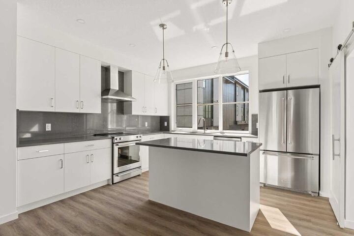 Property Photo: 1453 Naa Drive SW 401 AB T3H 6H7