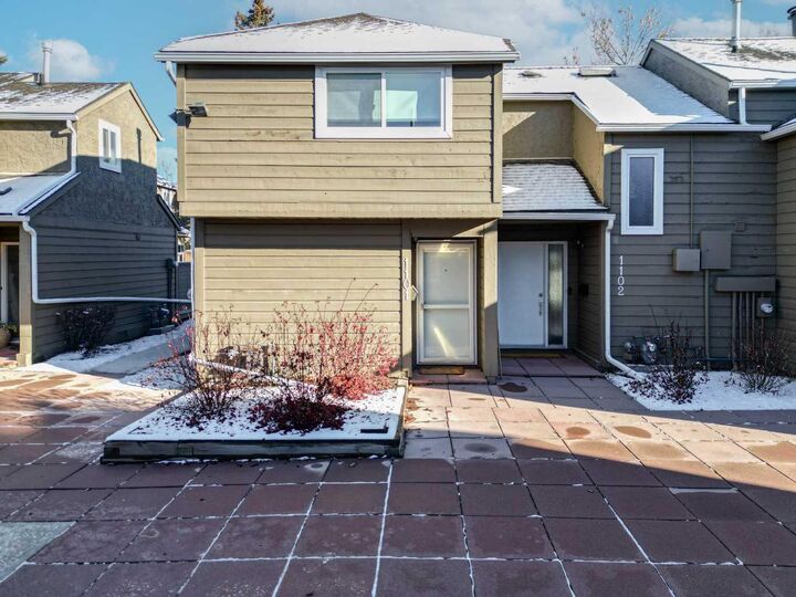 Property Photo: 829 Coach Bluff Crescent SW 1101 AB T3H 1B1