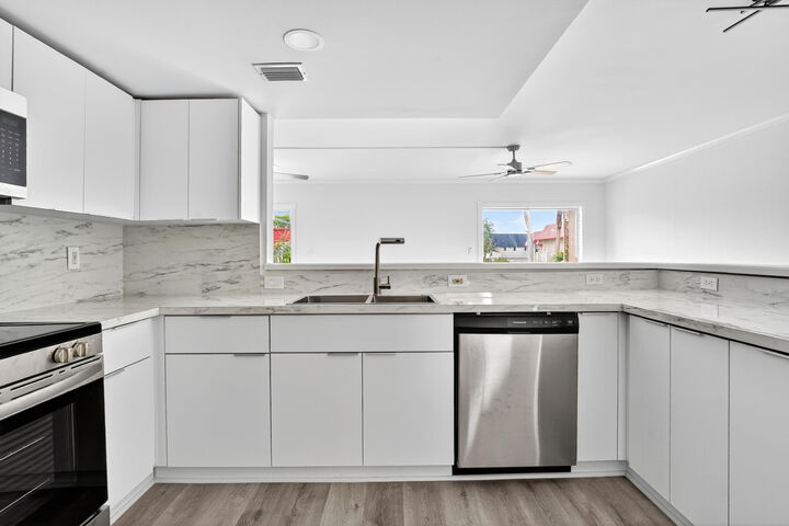Property Photo:  495 SE 8th Street 242  FL 33441 