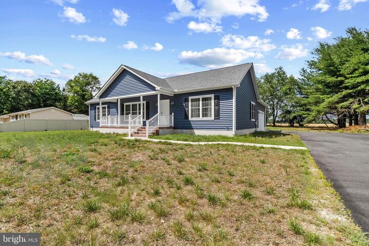 Property Photo: 22271 Cubbage Pond Road DE 19960