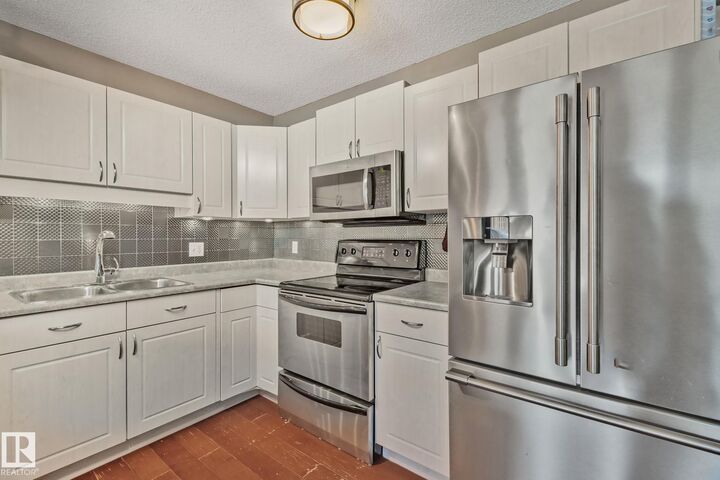 Property Photo:  12248 16 Avenue SW  AB T6W 1L7 