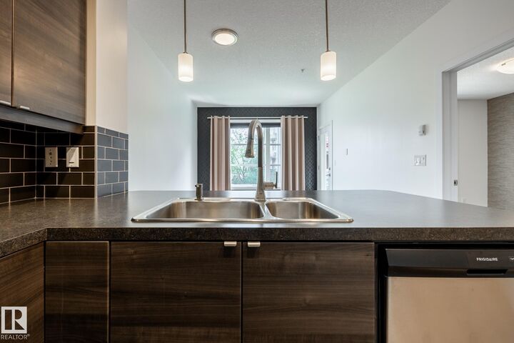 Property Photo: 2590 Anderson Way SW 215 AB T6W 0R2