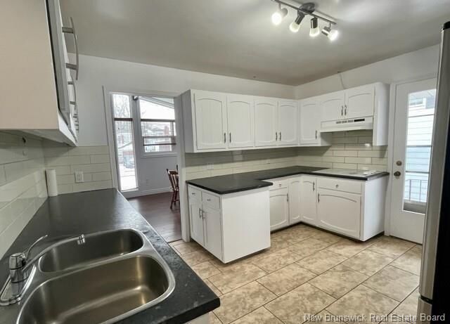 Property Photo: 141-143 West Lane NB E1C 6V1