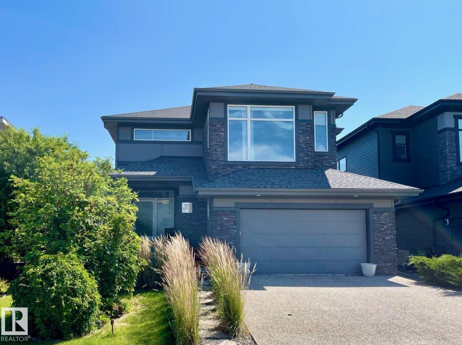 Property Photo: 1311 Hainstock Way SW AB T6W 3B6
