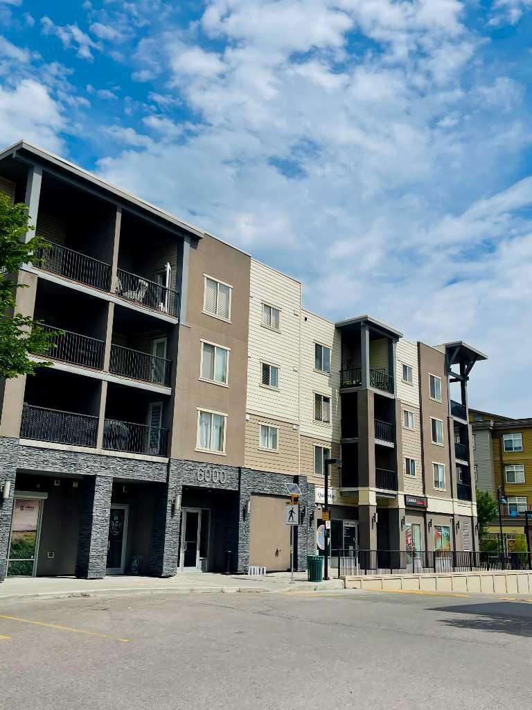Property Photo:  403 Mackenzie Way SW 6210  AB T4B 3V7 