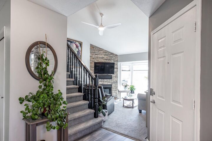 Property Photo: 26 Quigley Drive 7 AB T4C 1M2