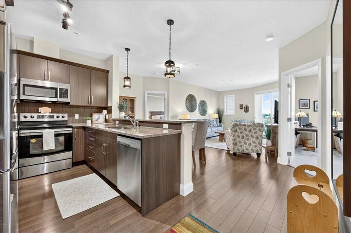 Property Photo:  15 Sunset Square 2305  AB T4C 0E7 