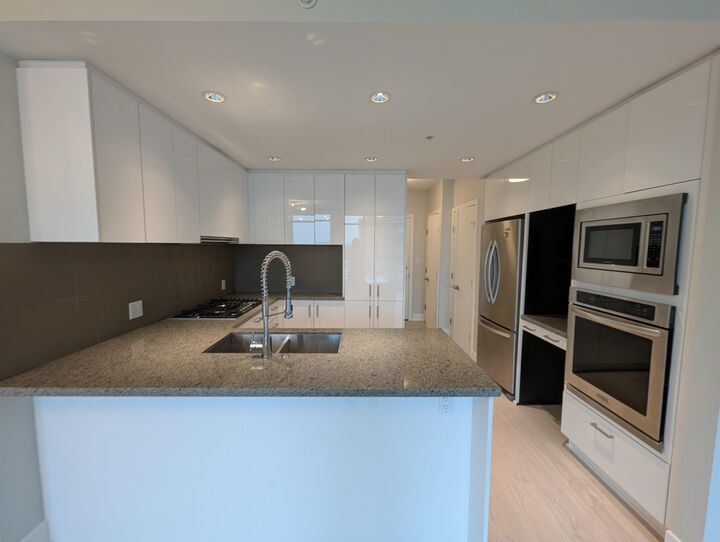 Property Photo: 3008 Glen Drive 1208 BC V3B 0J5
