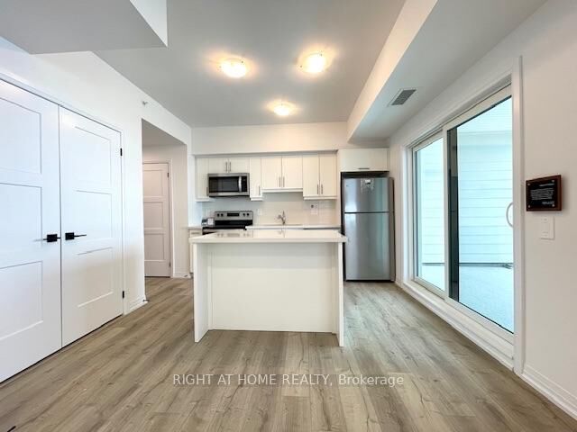 Property Photo: 15 Kneeshaw Drive 102 ON L9J 0X9