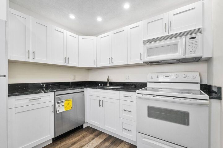 Property Photo:  2615 NE 1st Court 407  FL 33435 