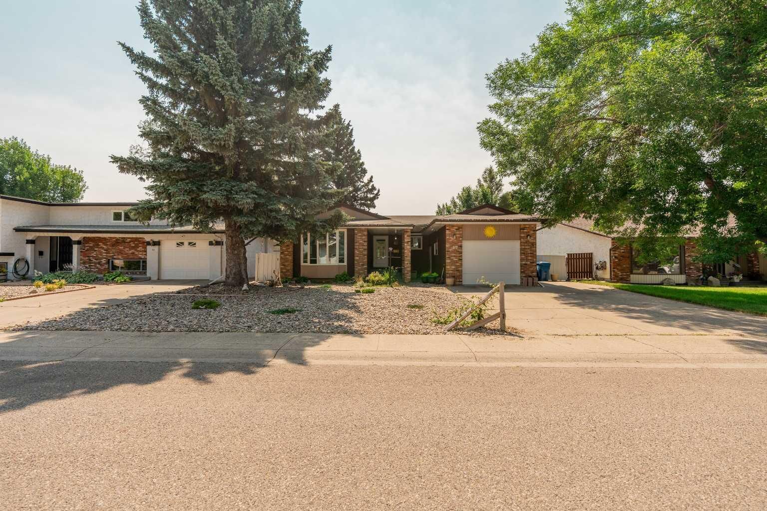 Property Photo: 42 Honeysuckle Road N AB T1H 4J9