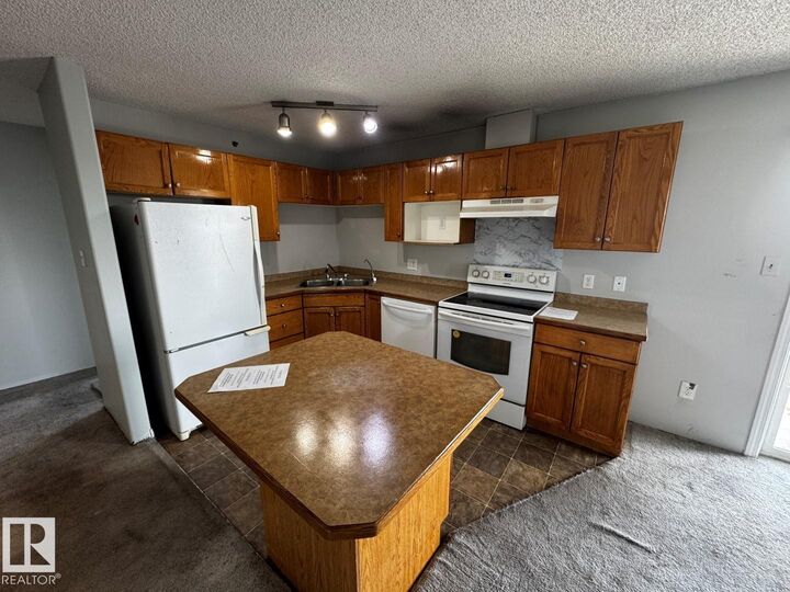 Property Photo:  2305 35A Avenue NW 428  AB T6T 1Z2 