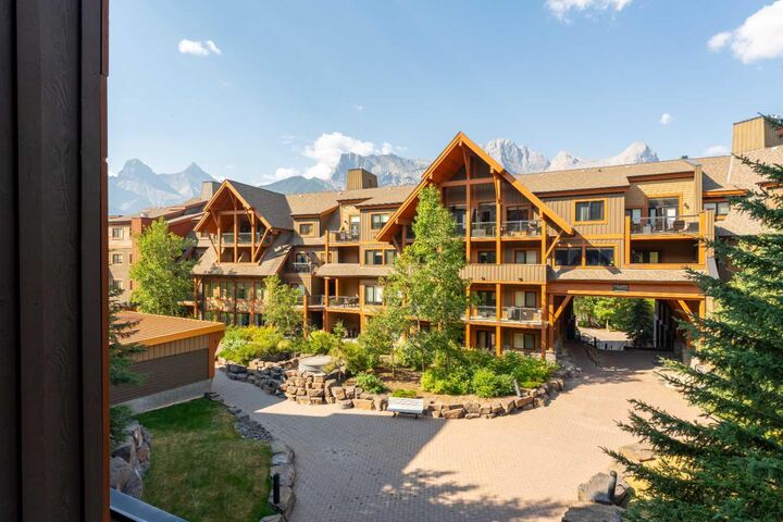 Property Photo: 173 Kananaskis Way 213 AB T1W 0A2