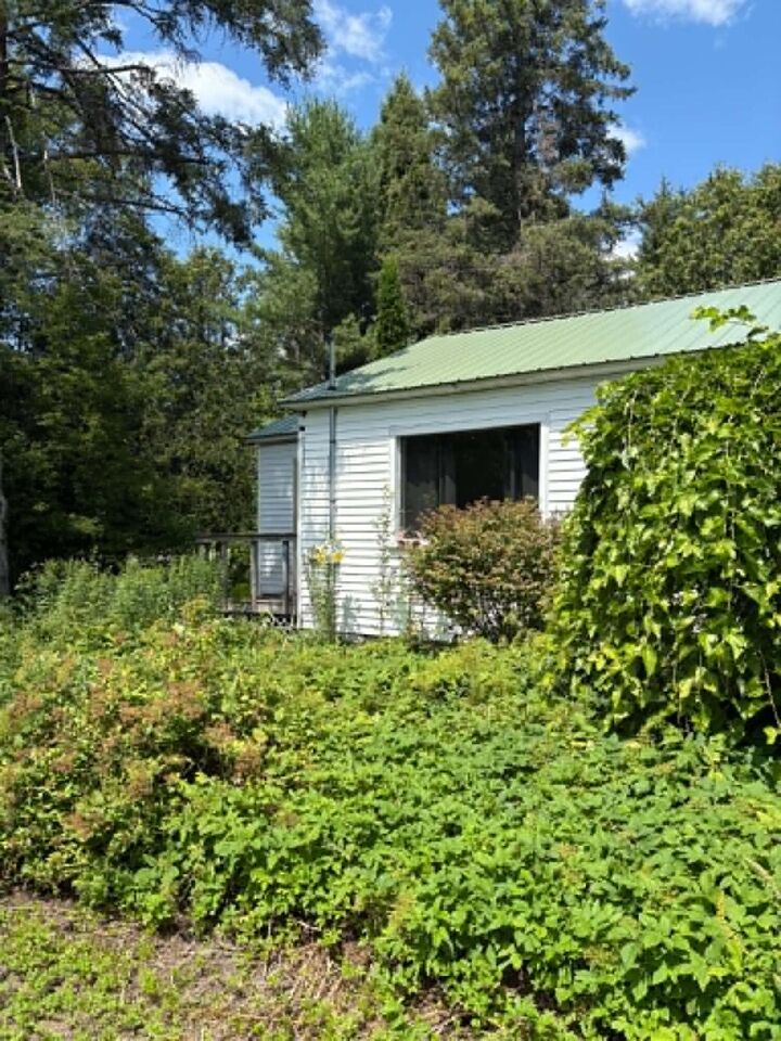 Property Photo:  7297 M-33  MI 49765 