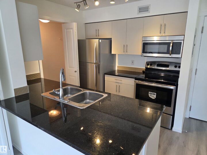 Property Photo: 5816 Mullen Place NW 309 AB T6R 0W3