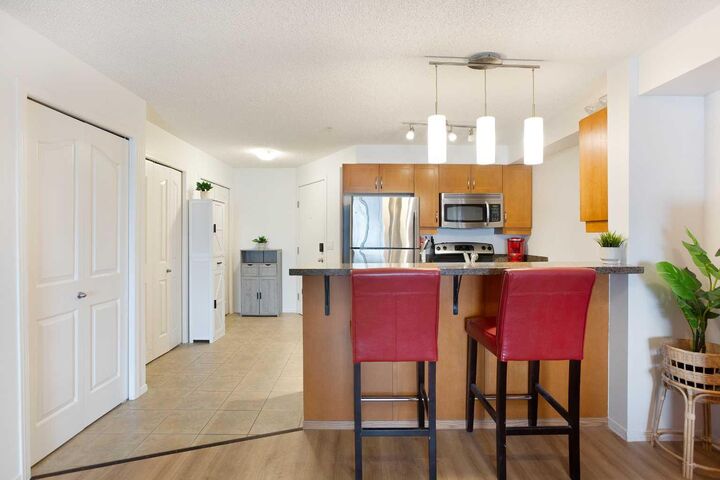 Property Photo:  60 Panatella Street NW 4310  AB T3K 0M4 