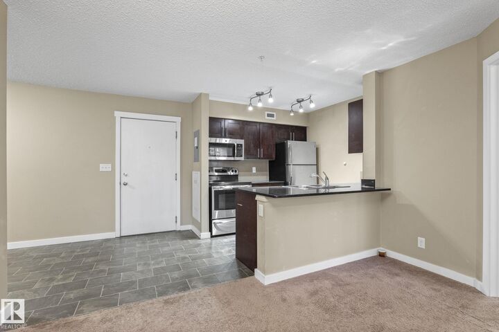 Property Photo:  12025 22 Avenue SW 116  AB T6W 2Y1 