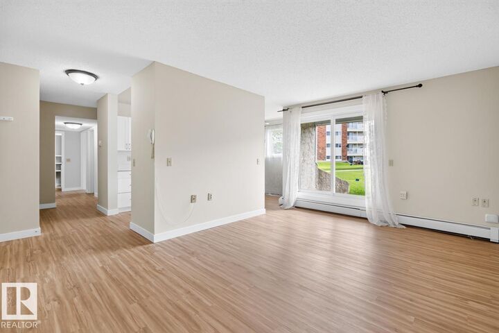 Property Photo:  11265 31 Avenue NW 5  AB T6J 3V7 