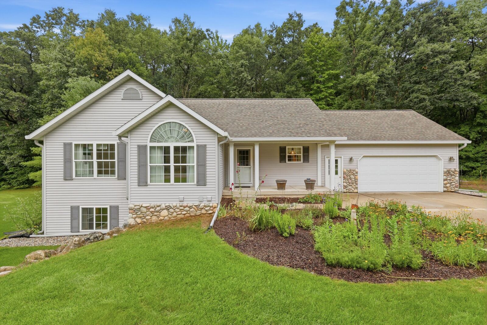 Property Photo:  5075 Bonasa Drive NE  MI 49341 
