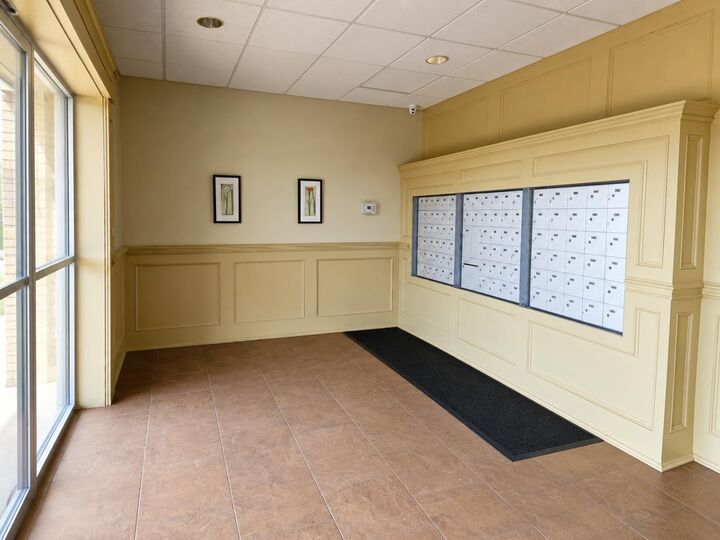 Property Photo: 4425 Heritage Way 406 AB T4L 2P4