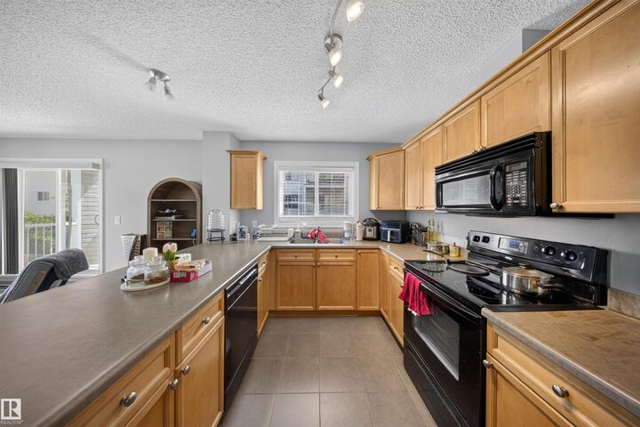 Property Photo: 4403 23 Street NW 215 AB T6T 0E4