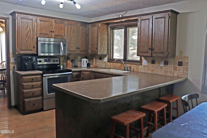 Property Photo:  216 Apollo Avenue  ND 58503 
