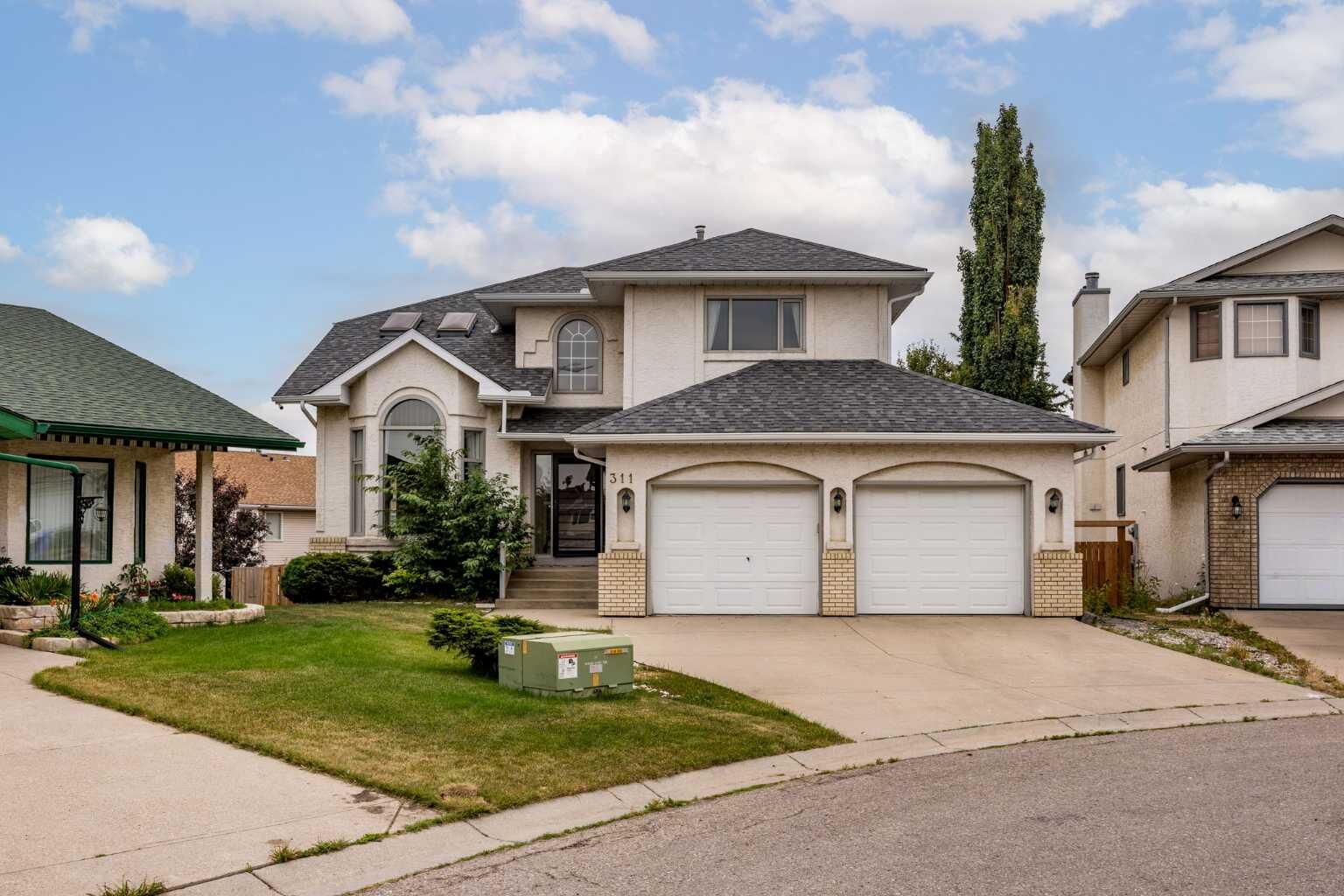 Property Photo: 311 Hawkland Place NW AB T3G 3R4