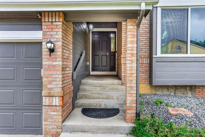 Property Photo:  5033 S Owens Street  CO 80127 