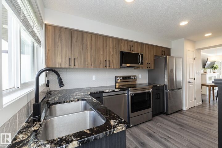 Property Photo: 1530 Tamarack Boulevard NW 28 AB T6T 2E6