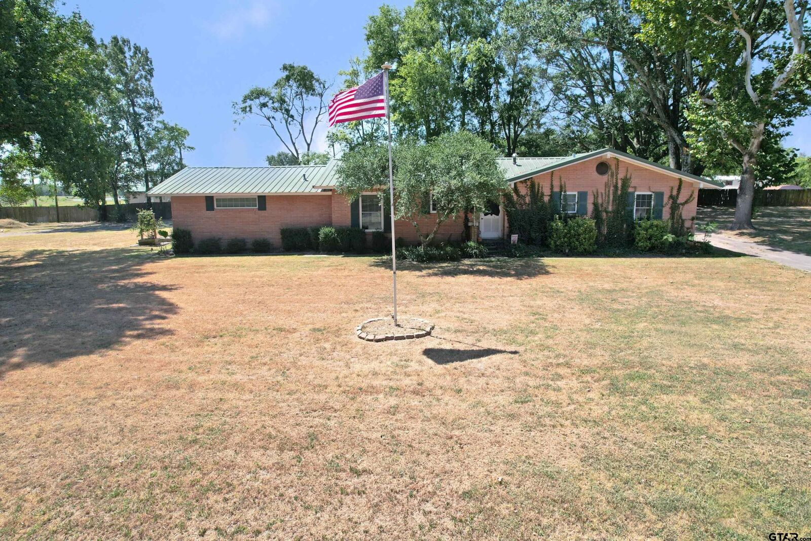 Property Photo: 111 E Oak St TX 75497