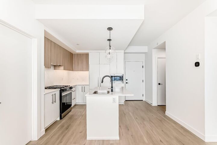Property Photo: 8375 Broadcast Avenue SW 415 AB T3H 6L3