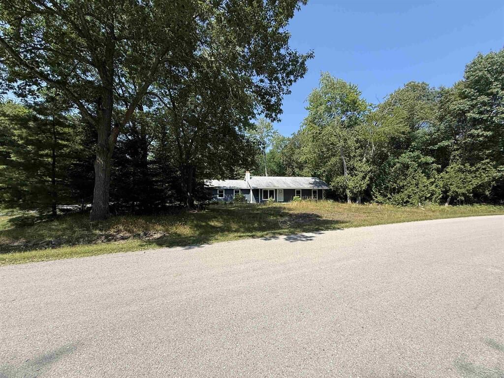 Property Photo:  4879 Kingswood Lane  MI 48750 