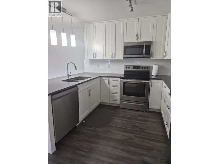 Property Photo:  6798 Westgate Avenue 401  BC V2N 5R2 