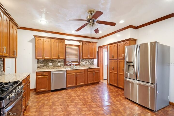 Property Photo:  7311 Montgomery Avenue  OH 44104 