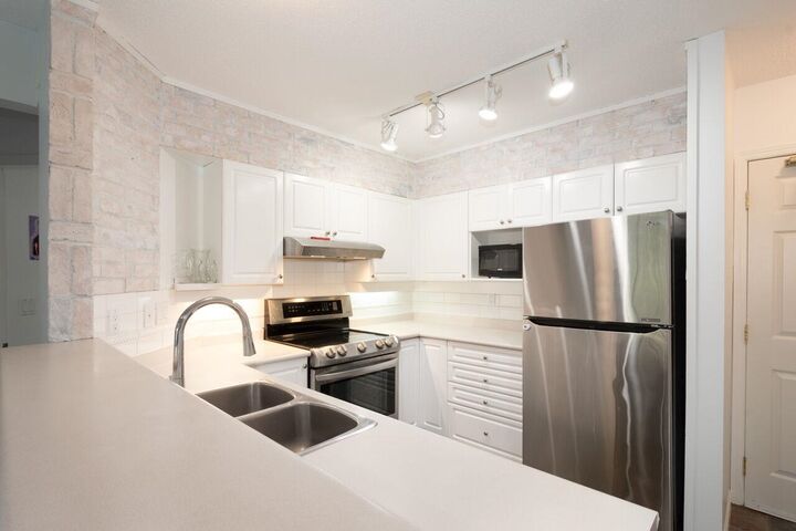 Property Photo:  3625 Windcrest Drive 104  BC V7G 2S6 