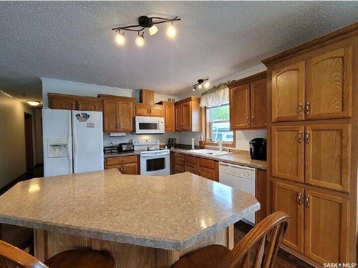 Property Photo:  210 4th Street E  SK S9X 1H5 