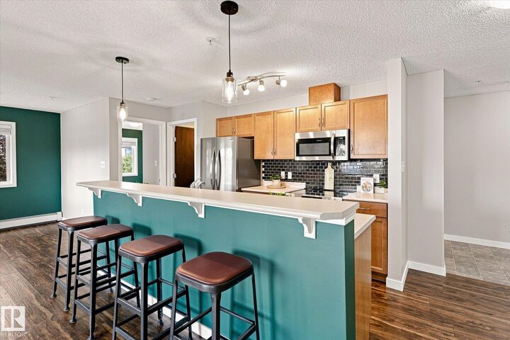 Property Photo:  1180 Hyndman Road NW 240  AB T5A 0P8 