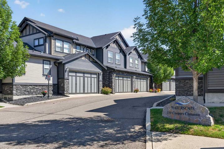 Property Photo: 110 Coopers Common SW 202 AB T4B 3Y3