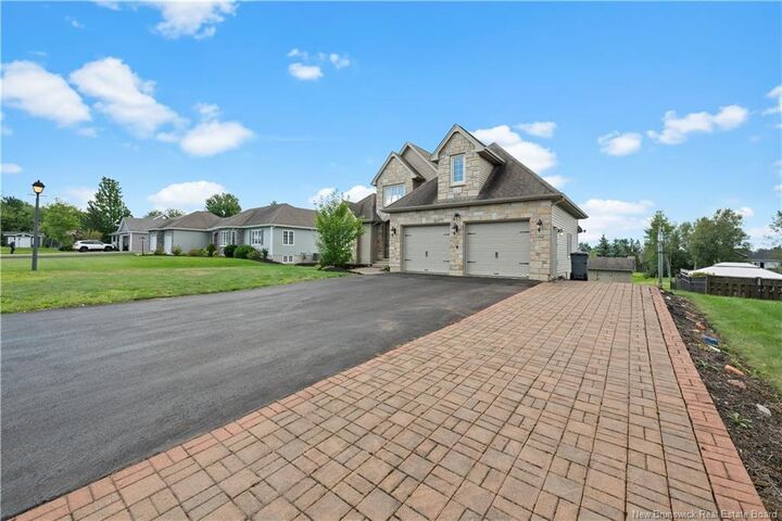 Property Photo: 415 Grande-Vallee Court NB E1A 8S1