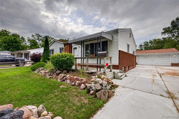 Property Photo:  310 Tamarac Drive  MI 48423 1938 