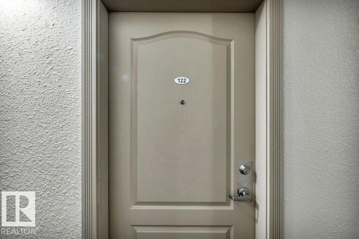 Property Photo:  12550 140 Avenue NW 122  AB T5X 6J4 