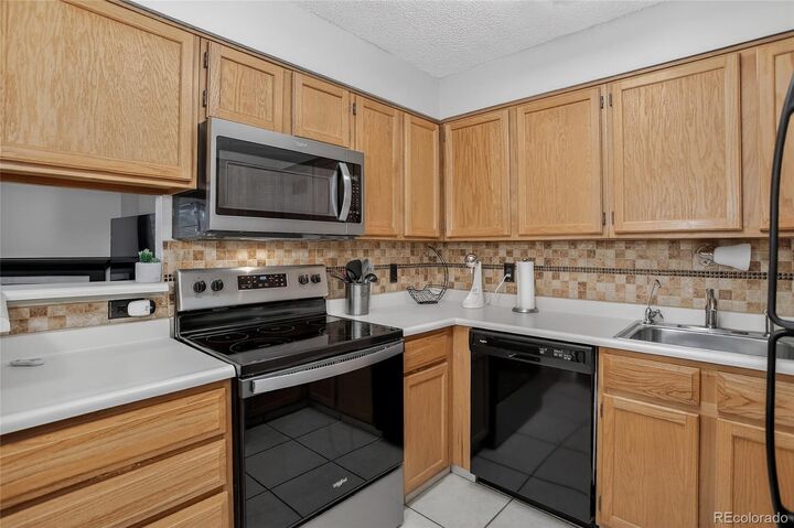 Property Photo:  3344 S Ammons Street 16-202  CO 80227 