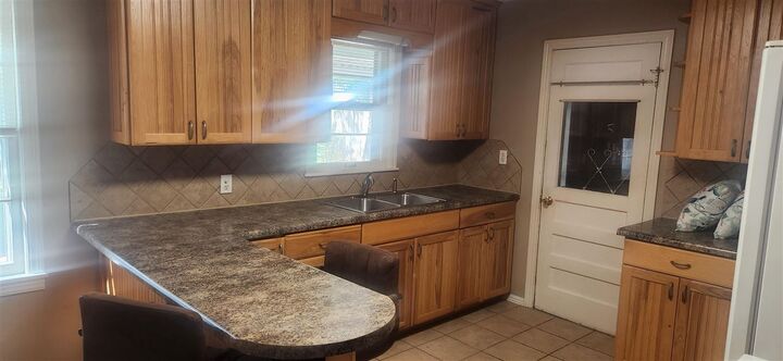 Property Photo:  1008 Poplar  OK 74601 