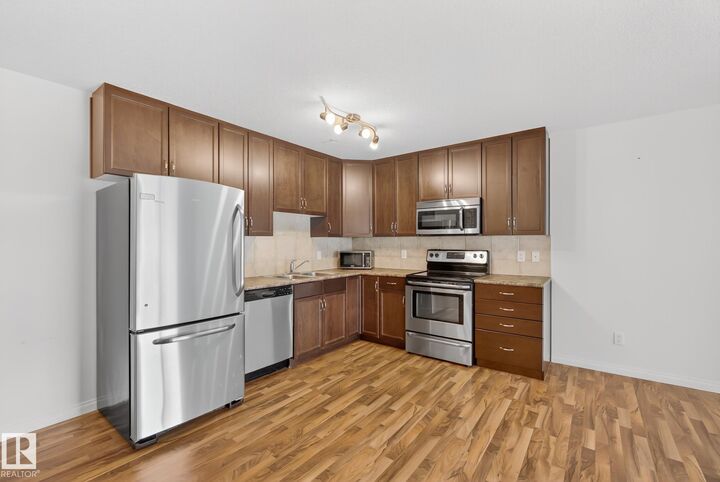 Property Photo:  1204 156 Street NW 216  AB T6R 0R6 