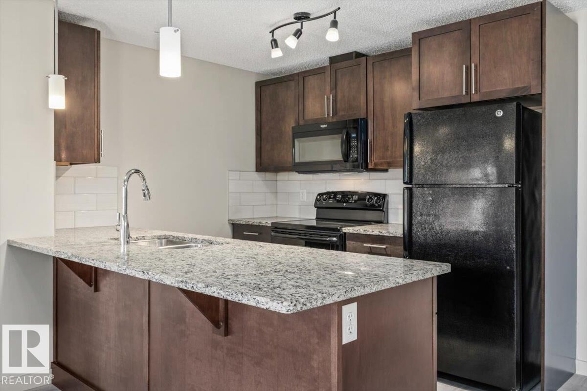 Property Photo: 6076 Schonsee Way NW 230 AB T5Z 0K8