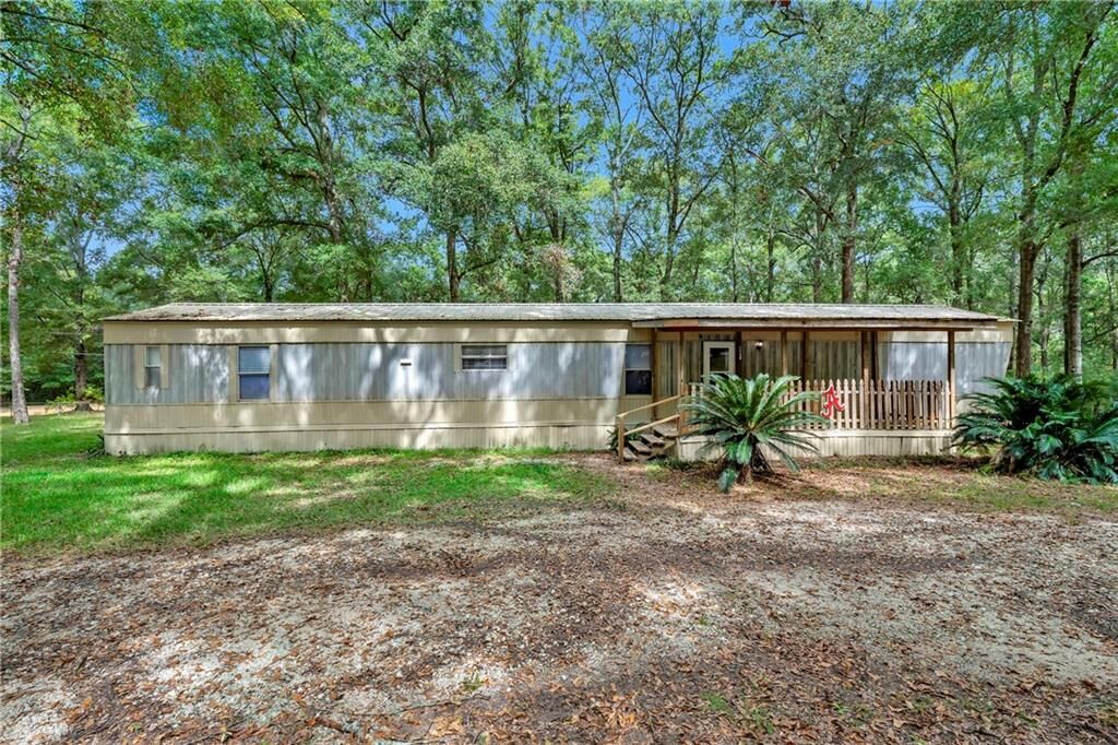 Property Photo: 7740 Murray Oaks Drive AL 36544
